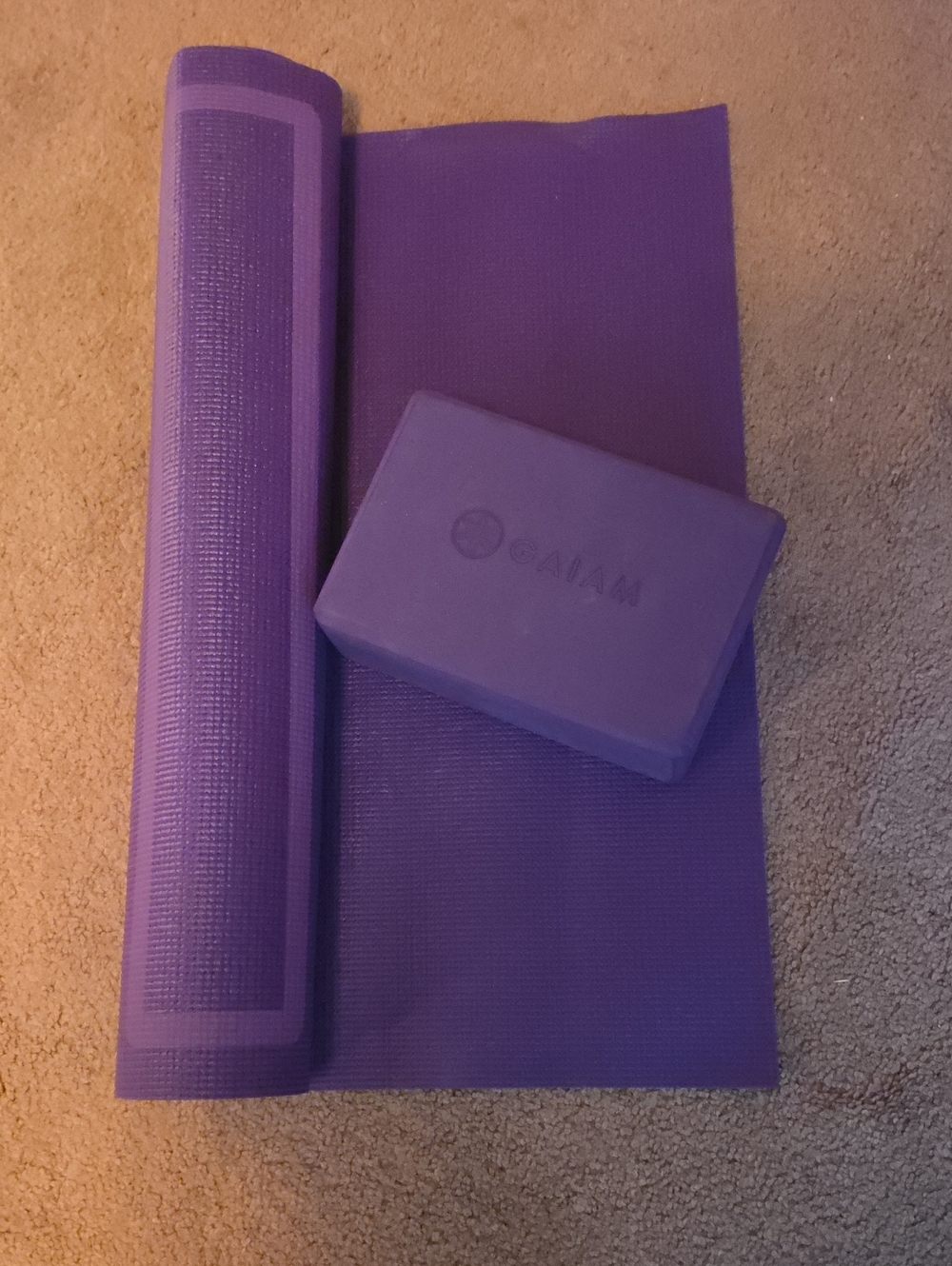 Yoga Mat And Block. Unrolled Once.